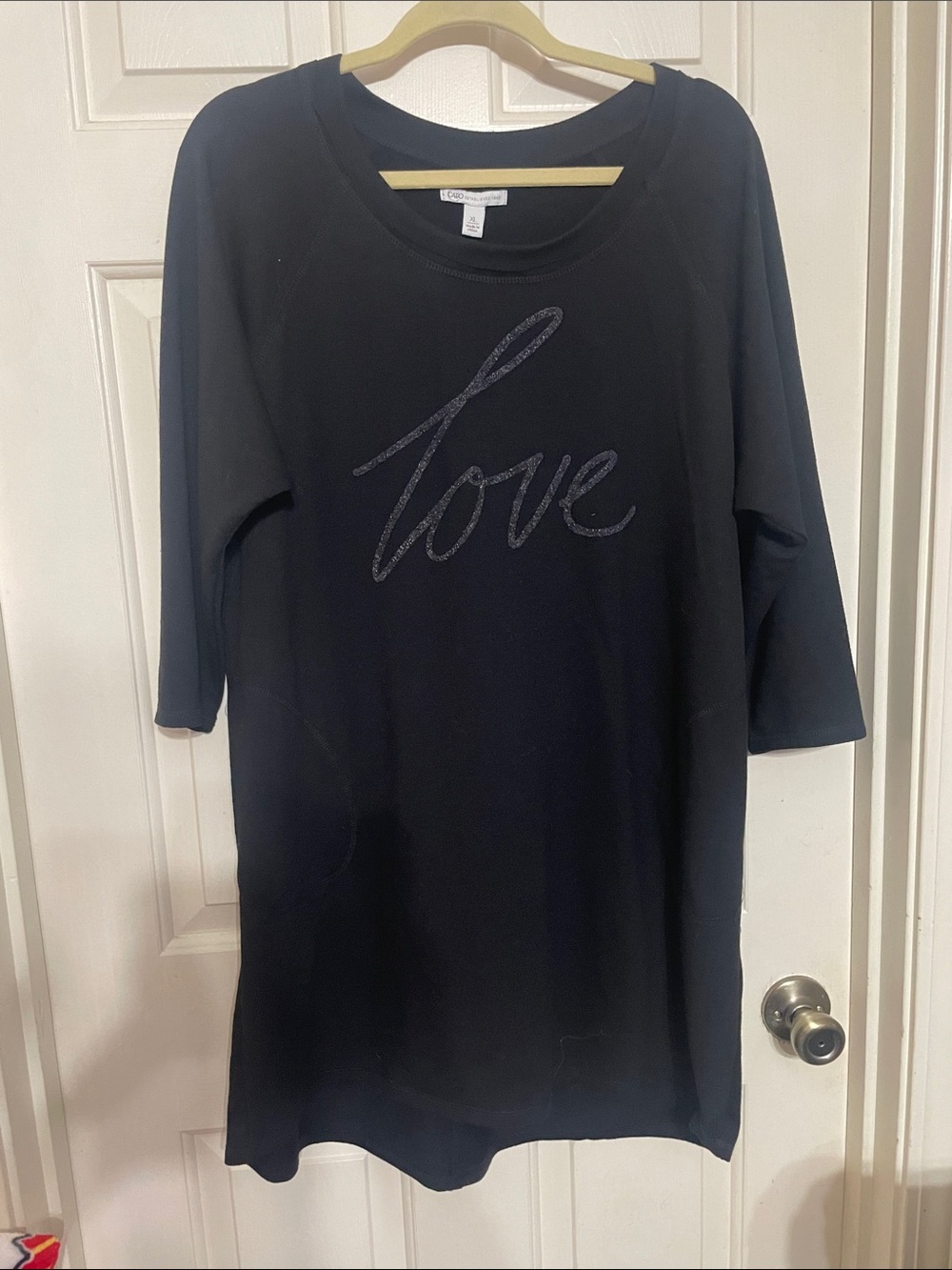 Cato Black Pullover Top with Branded Neck Label Love is spelled in beads.